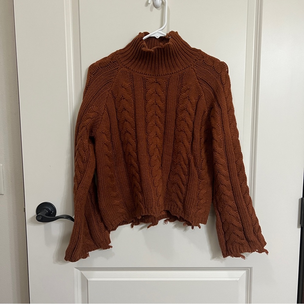 Rust colored cropped turtleneck sweater